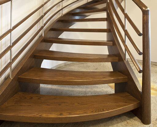 Amsterdam – Curved wooden staircase with flowing, organic lines